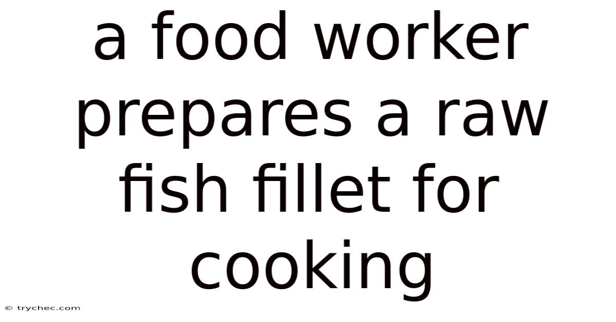 A Food Worker Prepares A Raw Fish Fillet For Cooking